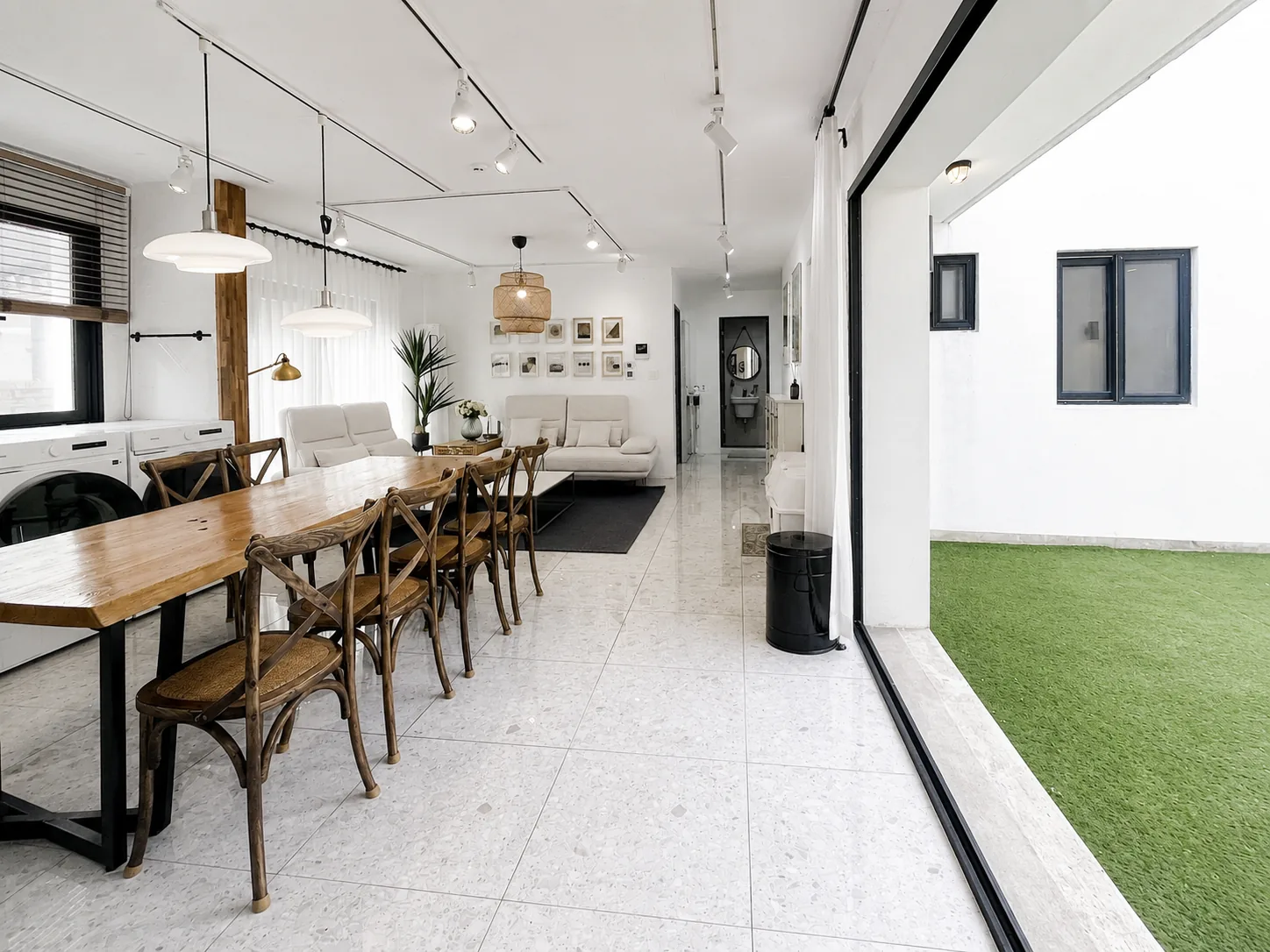 Long dining table beside the courtyard