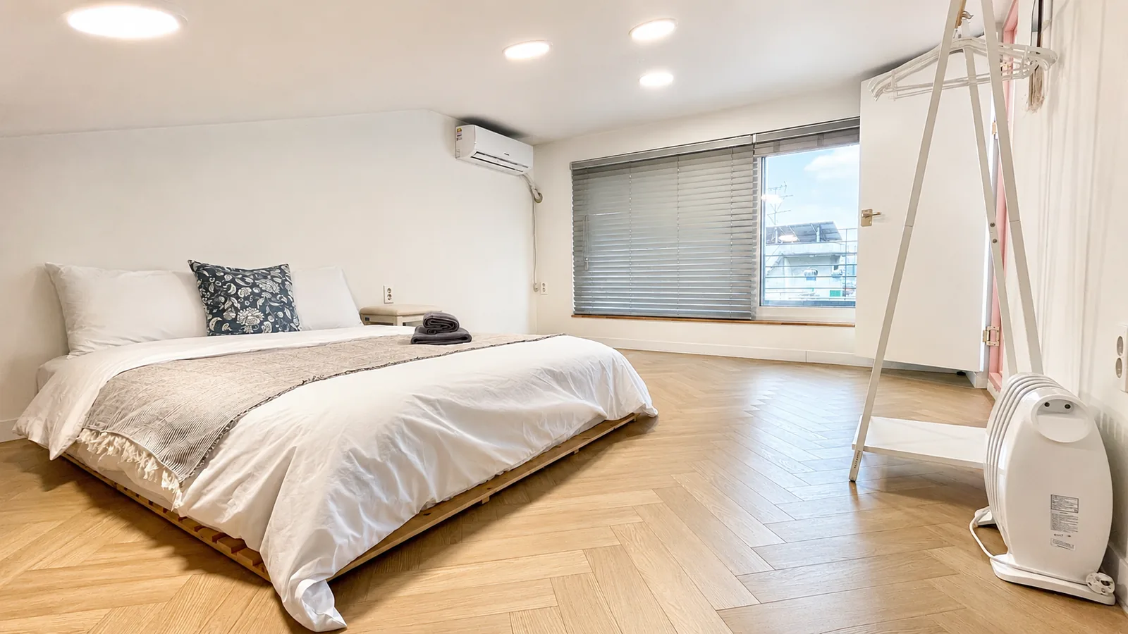 Second-floor bedroom with herringbone floor