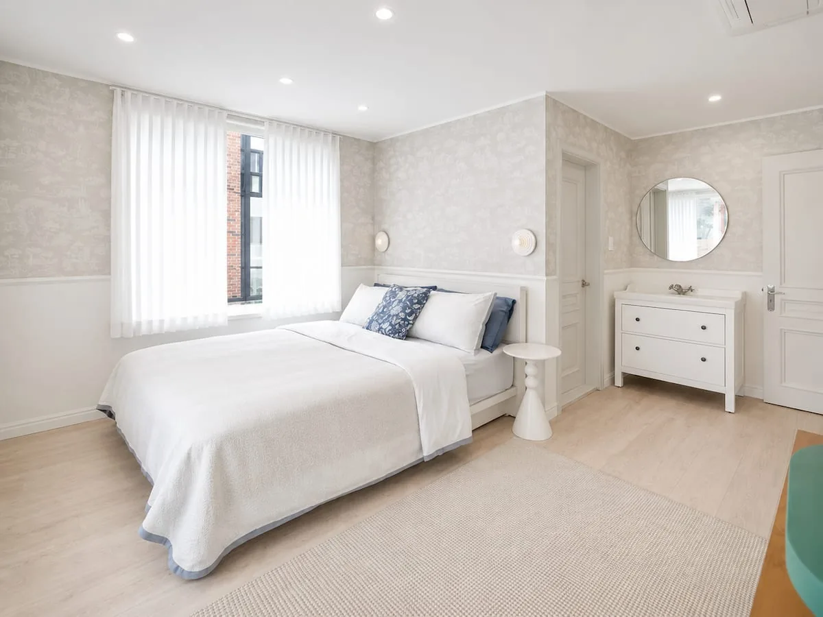 Bedroom with dresser, 302