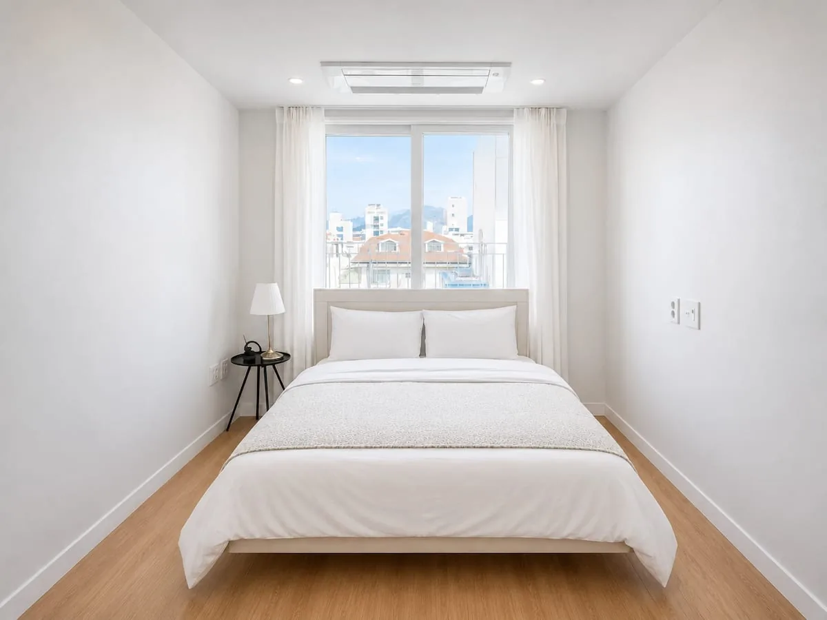 Bedroom with city view window